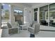 Stylish outdoor lounge area with comfortable seating, fireplace, and TV, offering a perfect spot for relaxation and entertainment at 350 Dahlia Row Dr, Summerville, SC 29486