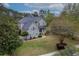 Charming two-story home with a landscaped front yard, blue shutters, and mature trees at 3805 Adrian Way, Mount Pleasant, SC 29466