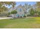 Charming two-story home with manicured front lawn, light blue shutters, and inviting curb appeal at 3805 Adrian Way, Mount Pleasant, SC 29466