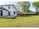 Side view of a home featuring a well-maintained lawn and a concrete patio at 397 Parkdale Dr, Charleston, SC 29414