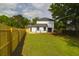 Spacious backyard featuring a freshly constructed wooden fence and a deck at 397 Parkdale Dr, Charleston, SC 29414