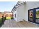 Newly constructed wooden deck features a dark metal railing and access to the backyard at 397 Parkdale Dr, Charleston, SC 29414