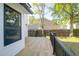 Freshly installed backyard wooden deck featuring a dark metal railing at 397 Parkdale Dr, Charleston, SC 29414