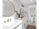 Modern bathroom featuring double sinks, round mirrors, and brushed gold hardware at 397 Parkdale Dr, Charleston, SC 29414