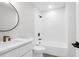 Clean bathroom with white subway tile, round mirror, modern vanity, and a shower-tub combination at 397 Parkdale Dr, Charleston, SC 29414