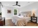Bright bedroom featuring a ceiling fan and a window that offers a view of the outdoors at 397 Parkdale Dr, Charleston, SC 29414