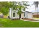 Charming two-story home with well-manicured lawn, dark trim, and inviting curb appeal at 397 Parkdale Dr, Charleston, SC 29414