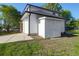 Exterior shot featuring a detached garage with a carriage door and a storage shed at 397 Parkdale Dr, Charleston, SC 29414