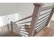 Modern staircase with wood treads and black metal railings leading to the floor below, featuring hardwood floors at 397 Parkdale Dr, Charleston, SC 29414