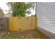 Wooden gate provides secure access to the backyard blending function with architectural design at 397 Parkdale Dr, Charleston, SC 29414