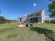 Large backyard with fire pit area, screened porch, and ample green space at 415 W Respite Ln, Summerville, SC 29483