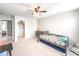 Bright bedroom featuring a ceiling fan, a single bed, and a closet for ample storage at 415 W Respite Ln, Summerville, SC 29483