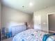Bedroom with a comfortable bed, dresser, and a well-lit space offers a retreat for rest and relaxation at 415 W Respite Ln, Summerville, SC 29483