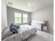 A serene bedroom with a comfortable bed, soft carpeting, and a bright window offers relaxation and rest at 415 W Respite Ln, Summerville, SC 29483