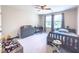 This bedroom features a daybed, desk, and lots of space for , offering a great space to learn and play at 415 W Respite Ln, Summerville, SC 29483