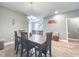 Charming dining room features a modern chandelier and a wooden dining table for Gathering gatherings at 415 W Respite Ln, Summerville, SC 29483