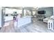 Modern kitchen with stainless steel appliances, granite countertops, and an open layout to living area at 415 W Respite Ln, Summerville, SC 29483