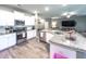 Stylish kitchen with stainless steel appliances, granite countertops, and a view into the living room at 415 W Respite Ln, Summerville, SC 29483
