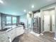 Bright kitchen features stainless steel appliances, granite countertops, ample cabinet space, and wood-look floors at 415 W Respite Ln, Summerville, SC 29483