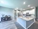 Open kitchen with a large island, stainless steel appliances, and white cabinets, great for cooking at 415 W Respite Ln, Summerville, SC 29483