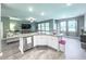 Open concept kitchen with granite countertops, stainless steel appliances, and a view into the living room at 415 W Respite Ln, Summerville, SC 29483