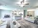 Open-concept living area with kitchen, dining, and living spaces, perfect for entertaining at 415 W Respite Ln, Summerville, SC 29483
