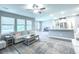Bright living room with neutral tones, large windows, and stylish decor for a welcoming atmosphere at 415 W Respite Ln, Summerville, SC 29483