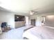 Bright main bedroom featuring modern furnishings, a ceiling fan, and walk-in closet access at 415 W Respite Ln, Summerville, SC 29483