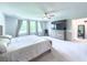 Spacious main bedroom boasts natural light from the large window and modern decor at 415 W Respite Ln, Summerville, SC 29483