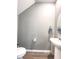 Compact powder room with a pedestal sink, oval mirror, and gray walls, for a clean, modern look at 415 W Respite Ln, Summerville, SC 29483
