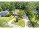 Aerial view of the home showing a large yard, circular driveway, swimming pool and lush landscaping at 44 S Basilica Ave, Hanahan, SC 29410