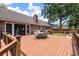 Large wooden back deck with outdoor dining set overlooking the backyard at 44 S Basilica Ave, Hanahan, SC 29410