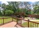 Spacious backyard deck overlooking a well-manicured lawn, patio, and gazebo at 44 S Basilica Ave, Hanahan, SC 29410
