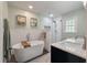 Luxurious bathroom with a soaking tub, glass shower and dual marble vanity at 44 S Basilica Ave, Hanahan, SC 29410