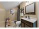 Cozy bathroom featuring a modern vanity, decorative mirror, and tiled floors at 44 S Basilica Ave, Hanahan, SC 29410