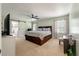 Bright bedroom with a barn door leading to the en suite bathroom at 44 S Basilica Ave, Hanahan, SC 29410