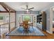 Inviting dining room with bay window, hardwood floors and a blue oriental rug at 44 S Basilica Ave, Hanahan, SC 29410