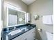 Modern bathroom features a blue granite countertop and a bright, well-lit mirror at 45 Sycamore Ave # 611, Charleston, SC 29407
