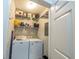 Convenient laundry room with washer, dryer, shelving and cleaning supplies at 45 Sycamore Ave # 611, Charleston, SC 29407