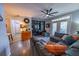 Comfortable living room with a large sectional sofa, built-in shelving, and access to a patio at 45 Sycamore Ave # 611, Charleston, SC 29407