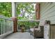 Inviting covered porch with cozy seating and charming decor, perfect for relaxing outdoors at 45 Sycamore Ave # 611, Charleston, SC 29407