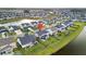 Aerial view of a house in a suburban neighborhood with a pond and well-maintained lawns at 451 Spectrum Rd, Summerville, SC 29486