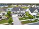 Spacious two-story home in a Gathering-friendly neighborhood, boasting lush lawns and serene pond views at 451 Spectrum Rd, Summerville, SC 29486