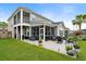 Expansive backyard featuring a patio, lush lawn, and attractive landscaping, ideal for outdoor activities and relaxation at 451 Spectrum Rd, Summerville, SC 29486