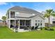 A well-maintained backyard with a patio area and a lush green lawn, perfect for entertaining and outdoor enjoyment at 451 Spectrum Rd, Summerville, SC 29486