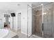 Bright bathroom features an enclosed glass shower, tile, and view into the main bedroom at 451 Spectrum Rd, Summerville, SC 29486