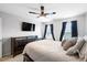 Comfortable bedroom with ceiling fan, TV, dresser, and large window views at 451 Spectrum Rd, Summerville, SC 29486