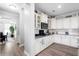 Updated kitchen with white cabinets, hardwood floors, and modern appliances at 451 Spectrum Rd, Summerville, SC 29486