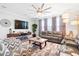 Bright living room with plush seating and ceiling fan at 451 Spectrum Rd, Summerville, SC 29486