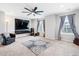 Spacious living room featuring a television, comfortable seating, and bright natural light at 451 Spectrum Rd, Summerville, SC 29486